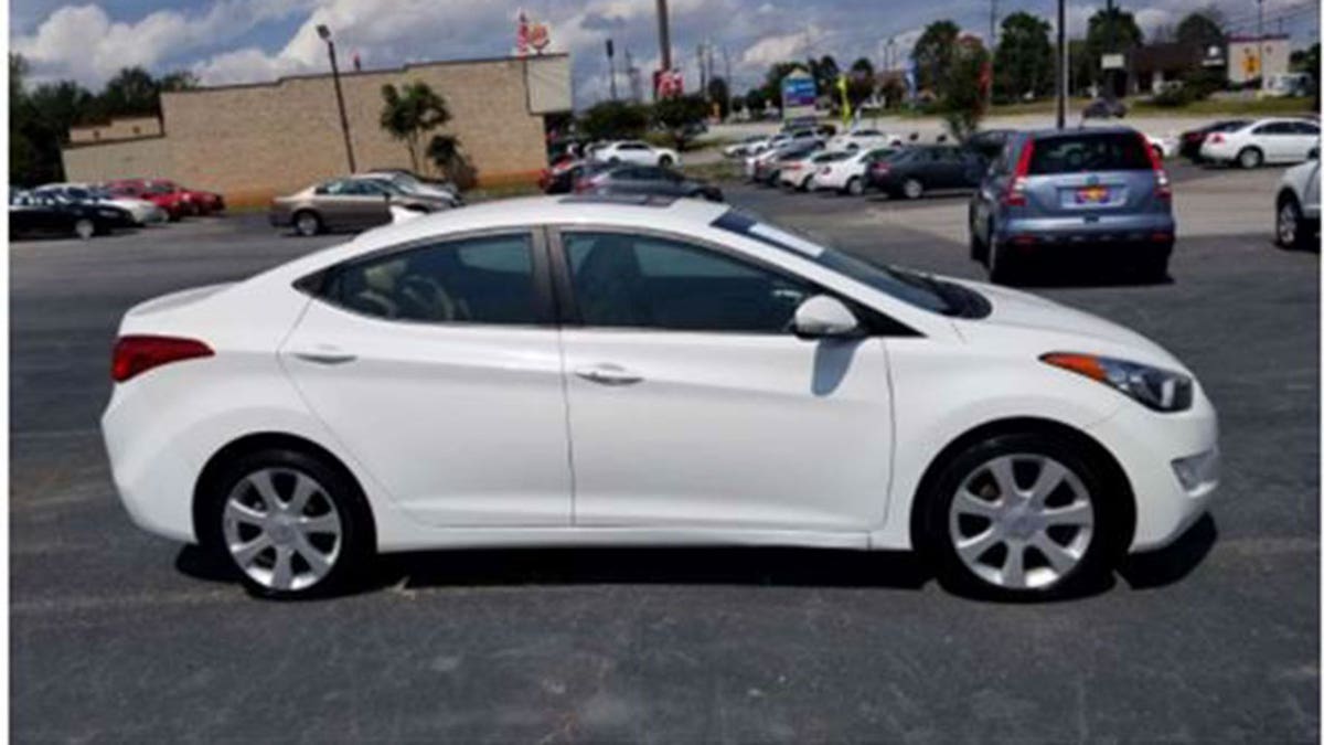 White hyundai sedan parked