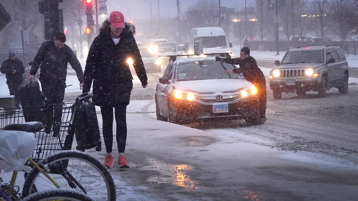 A winter weather system and sub-zero temperatures caused snow and strong winds in Chicago.