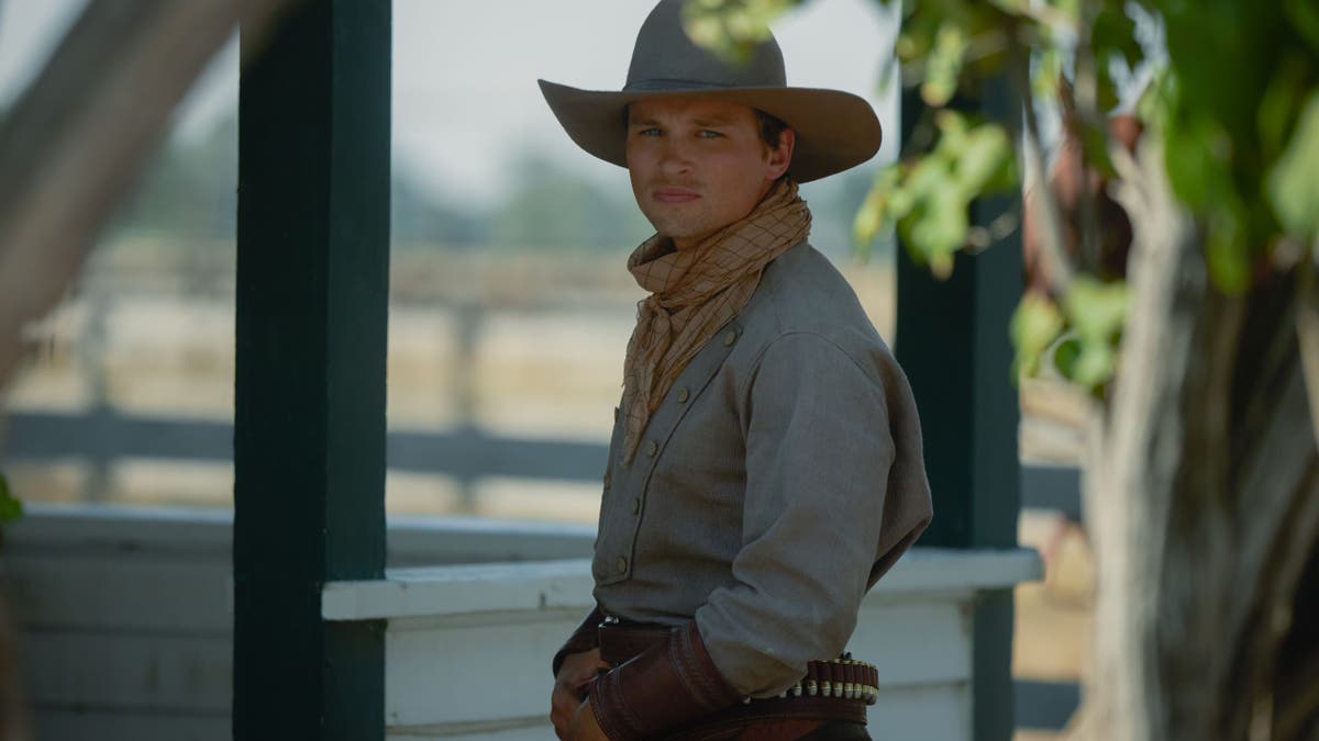 Darren Mann poses in cowboy attire