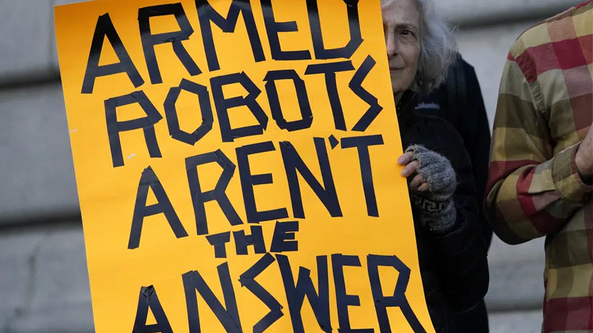 Sign protesting armed robots