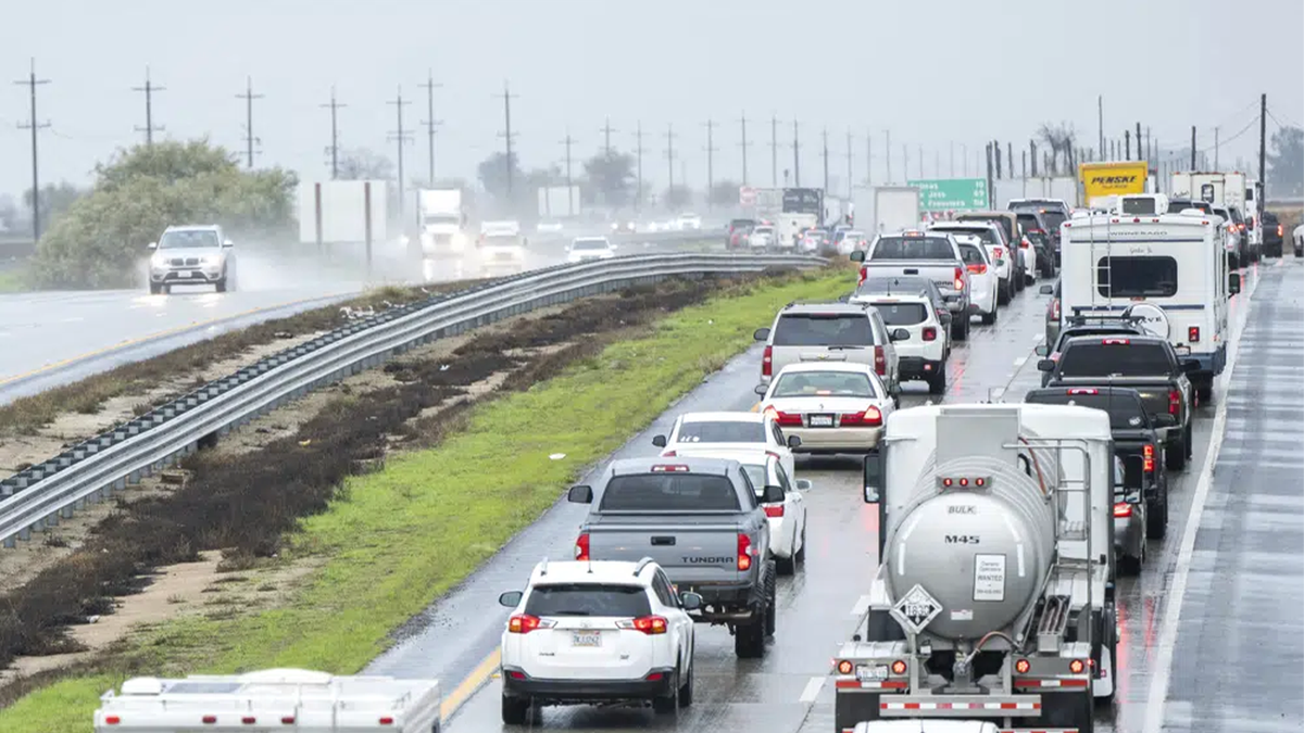 cars stuck on flooded highway