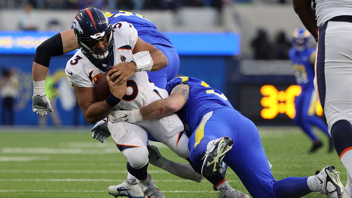 Russell Wilson sacked during a game