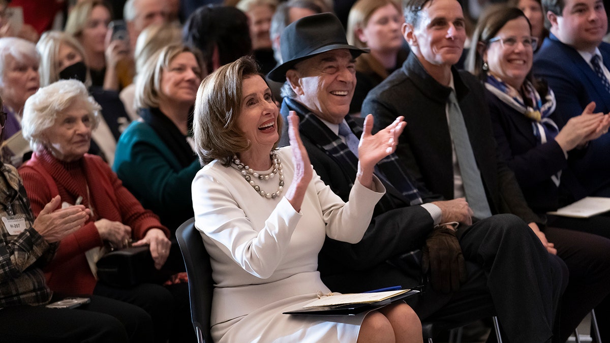 Rep. Nancy Pelosi, D-Calif., is joined by her family and husband Paul Pelosi as they attend her portrait unveiling ceremony in Statuary Hall at the Capitol in Washington, Dec. 14, 2022.