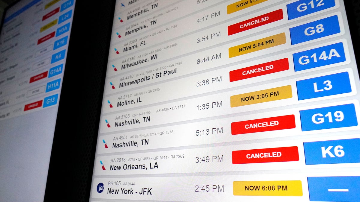 Board showing flight cancelations and delays