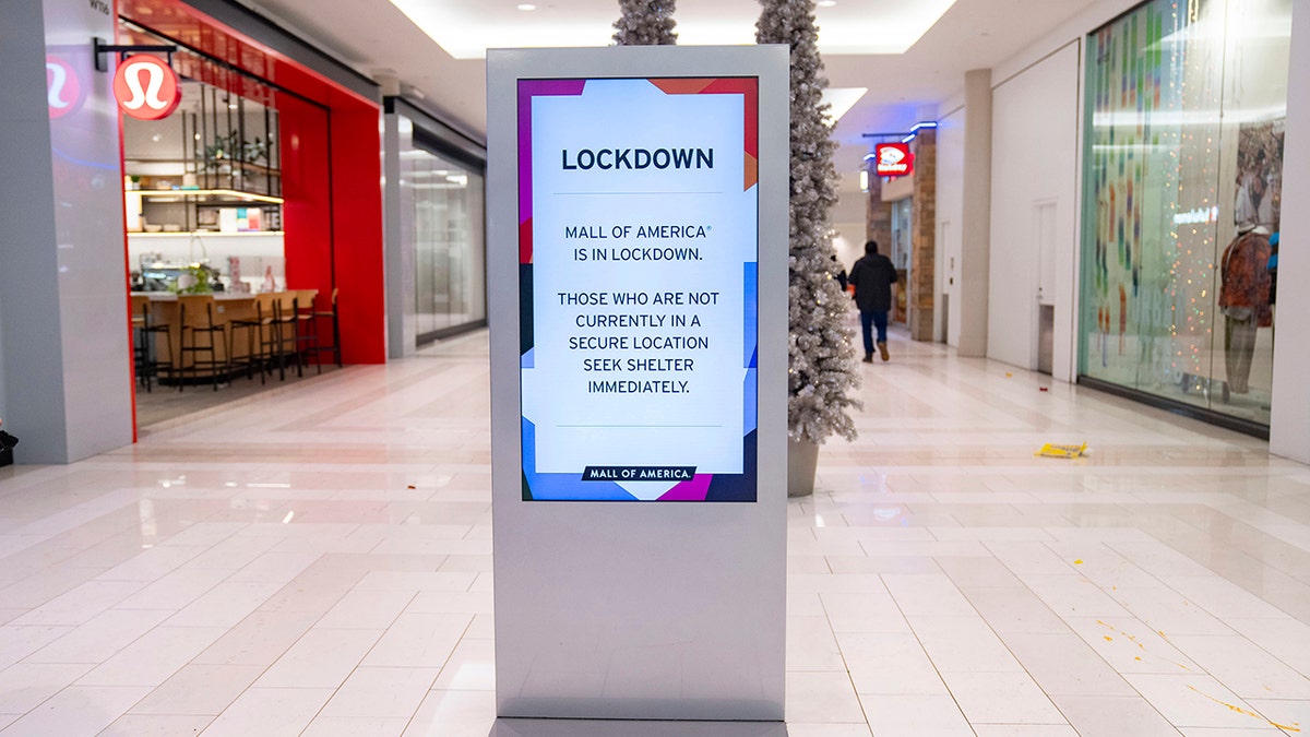 A sign saying the mall is under lockdown