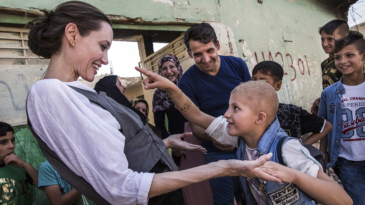 Angelina Jolie with refugees