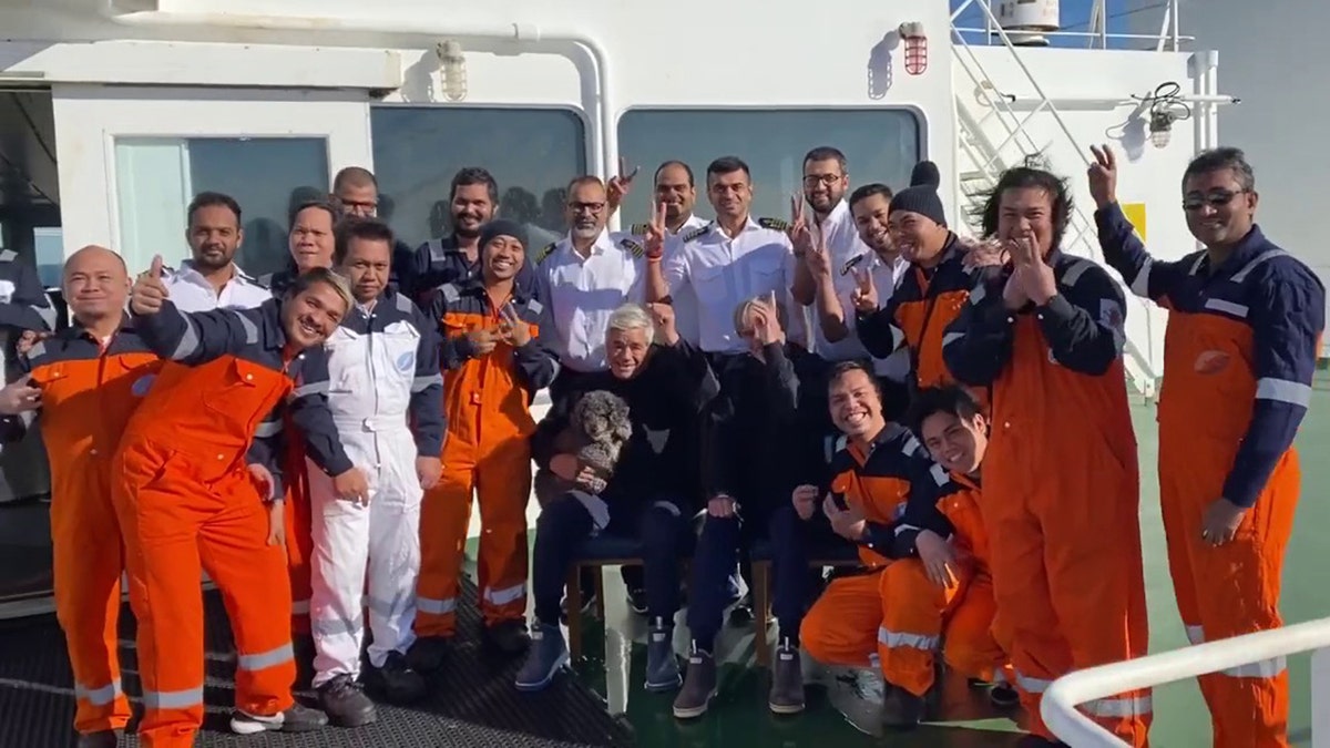 The crew took a photo with the rescued men