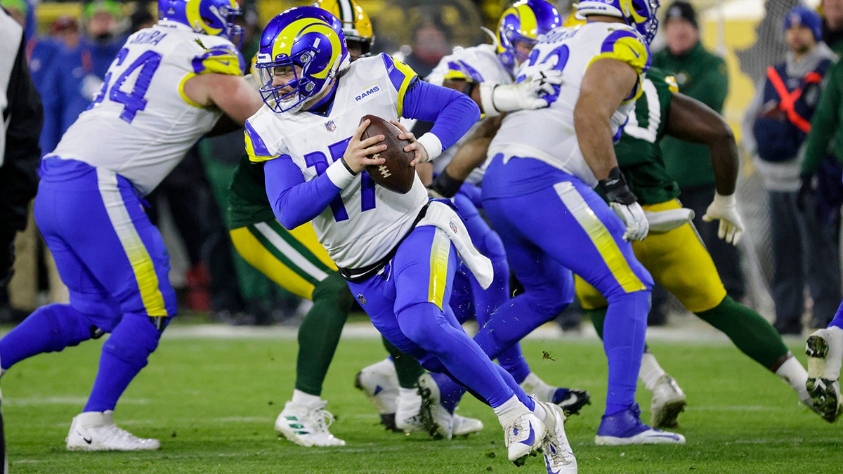 BALTIMORE, MD - DECEMBER 19: Packers running back A.J. Dillon (28) runs the  ball during the Green Bay Packers versus Baltimore Ravens NFL game at M&T  Bank Stadium on December 19, 2021