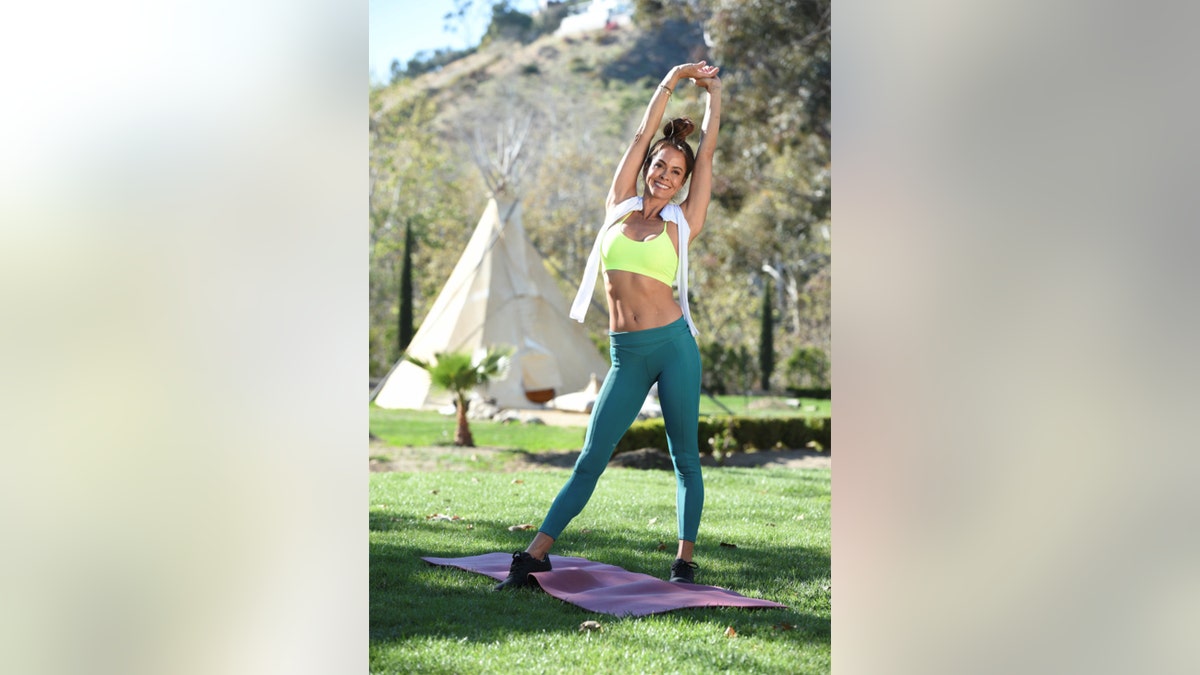 Brooke Burke stretching