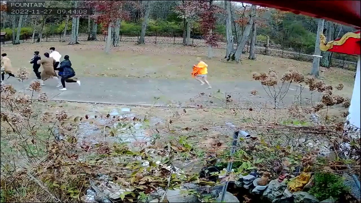 Buddhist monk chasing suspects