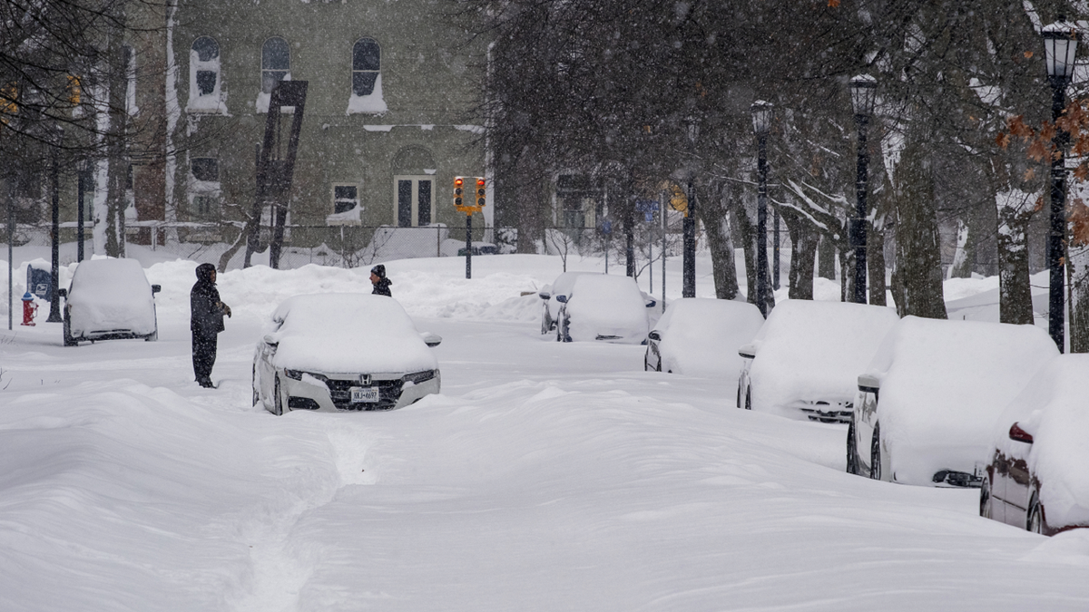 An abandoned car rests on a street in the Elmwood Village neighborhood of Buffalo, New York, on Monday.