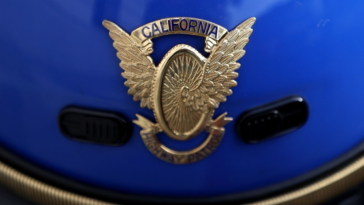 closeup of California Highway Patrol badge on helmet