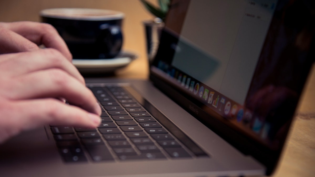 A man uses a computer