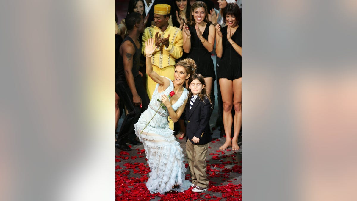 Celine Dion holds a rose at last Caesar's show