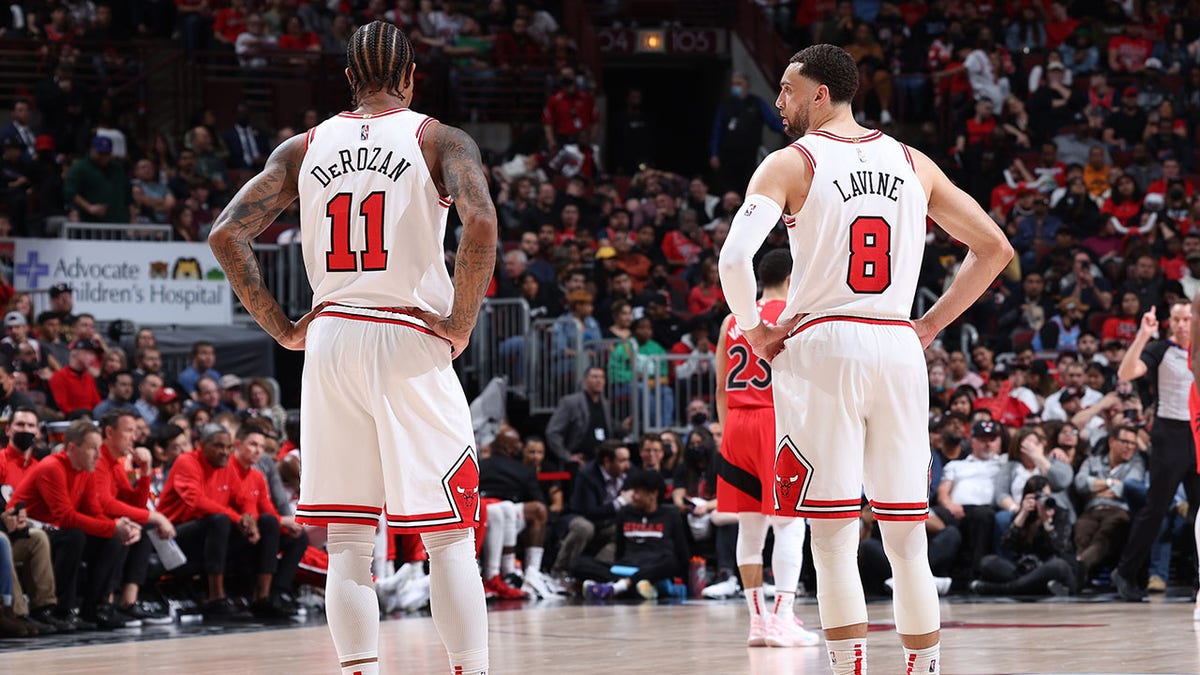 Zach LaVine and DeMar DeRozan talk during a game