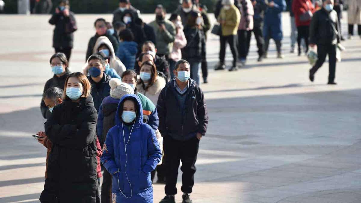 People lined up in masks