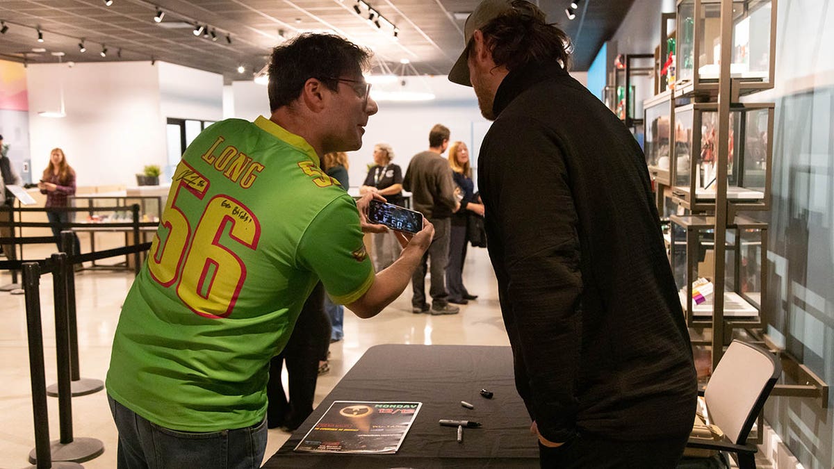 Chris Long meets with a fan