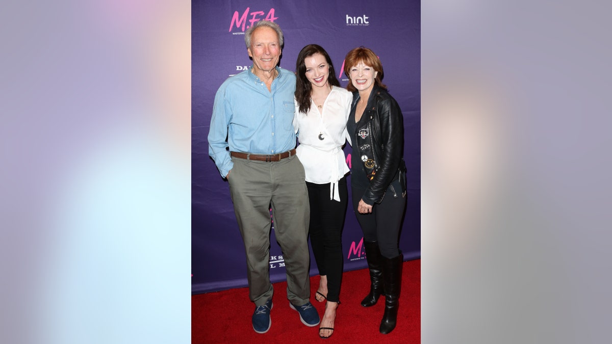 Clint Eastwood, Francesca Eastwood and Frances Fisher smile at the premiere Of Dark Sky Films' "M.F.A."