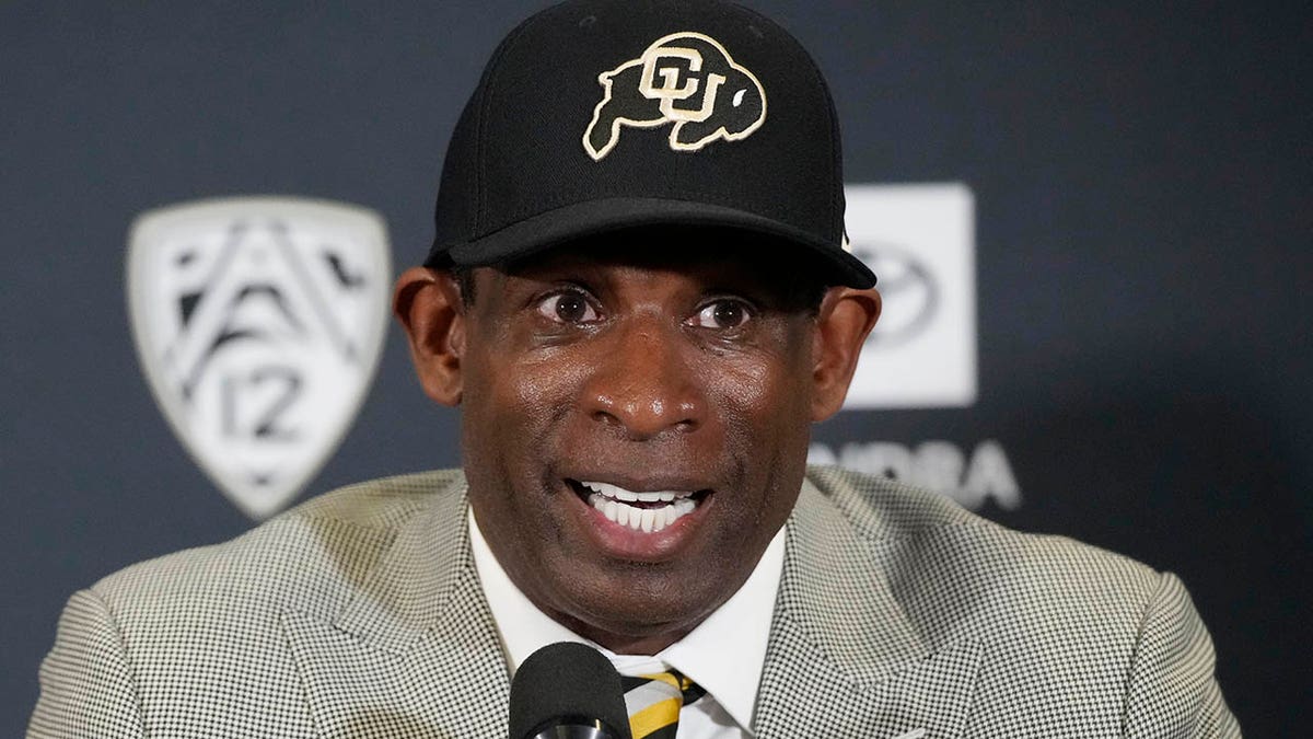 Deion Sanders at a press conference