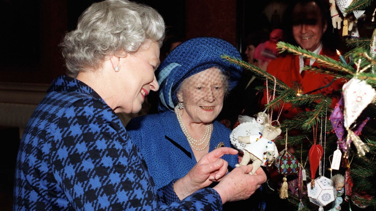 Queen Elizabeth II admiring Christmas ornament