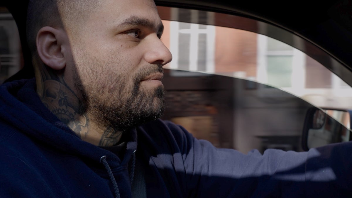 Frank Rodriguez drives through Kensington, an open air drug market