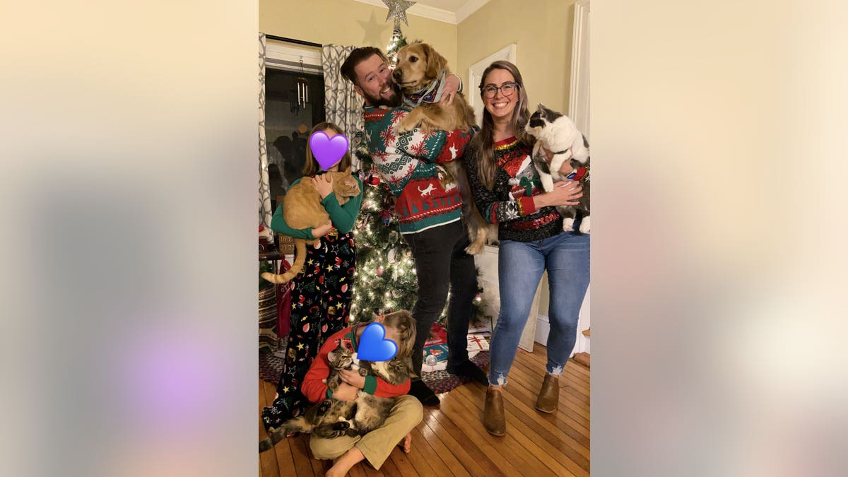 Steele family posing in front of the Christmas Tree.