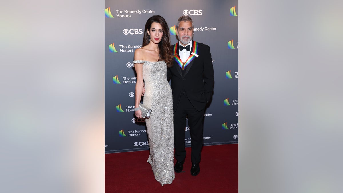 George Clooney wears tuxedo on red carpet with Amal Clooney