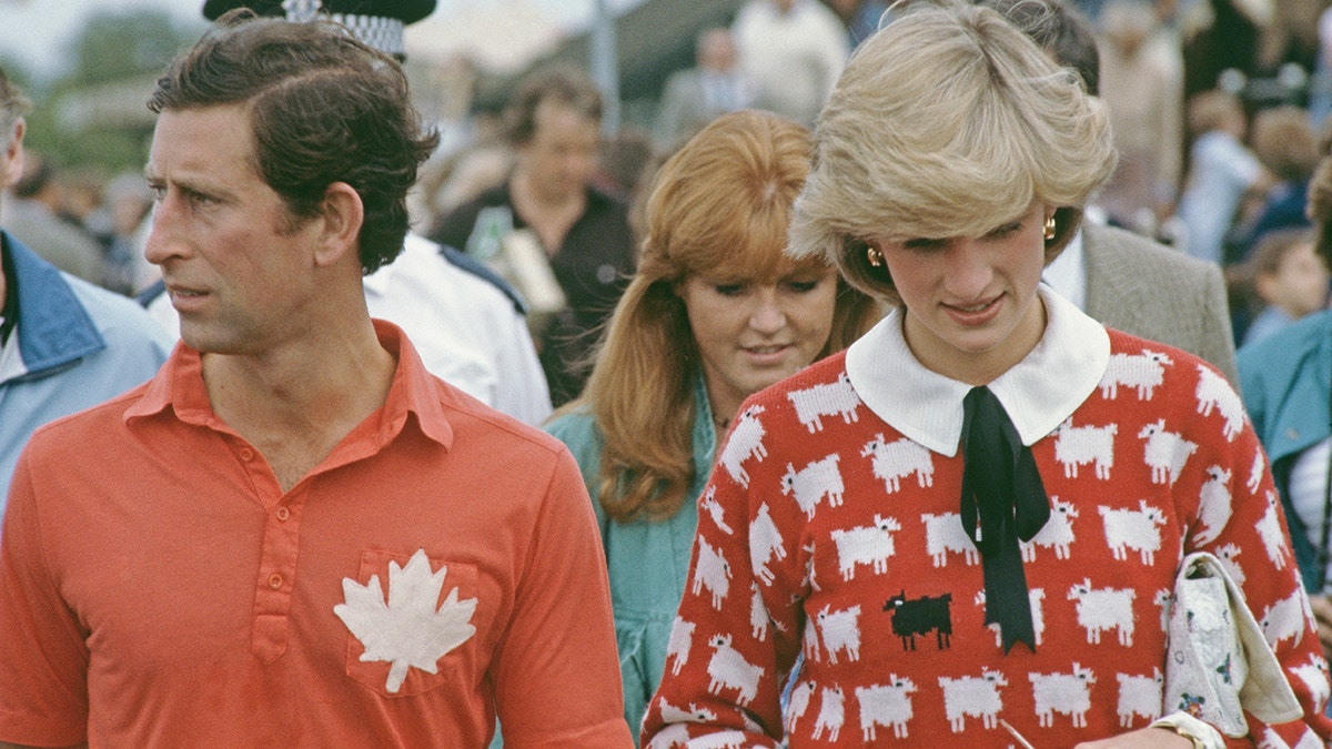 Princess Diana wearing a black sheep sweater at a polo match with Prince Charles and Sarah Ferguson