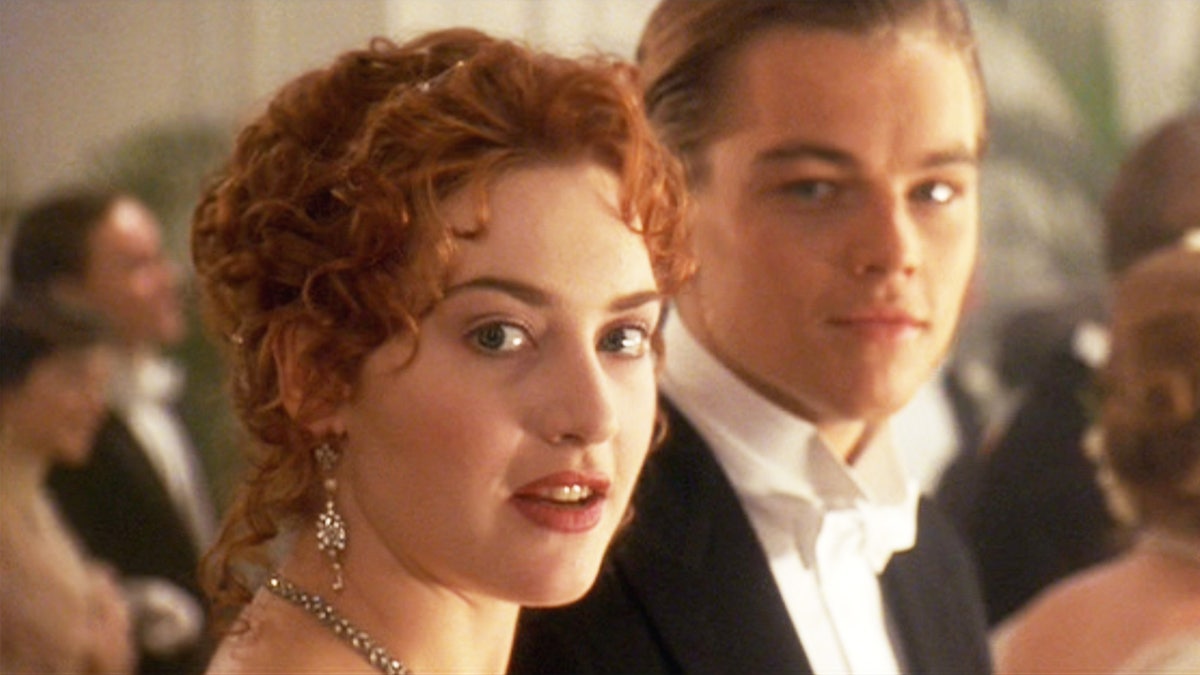 Kate Winslet and Leonardo DiCaprio in the "Titanic" where he wears a black suit and white shirt and she wears dangly earrings and a pretty necklace