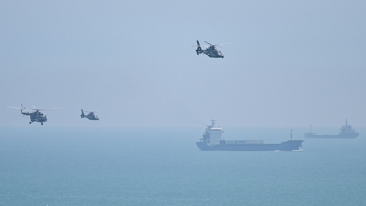 Chinese helicopters near Taiwan, ships in background