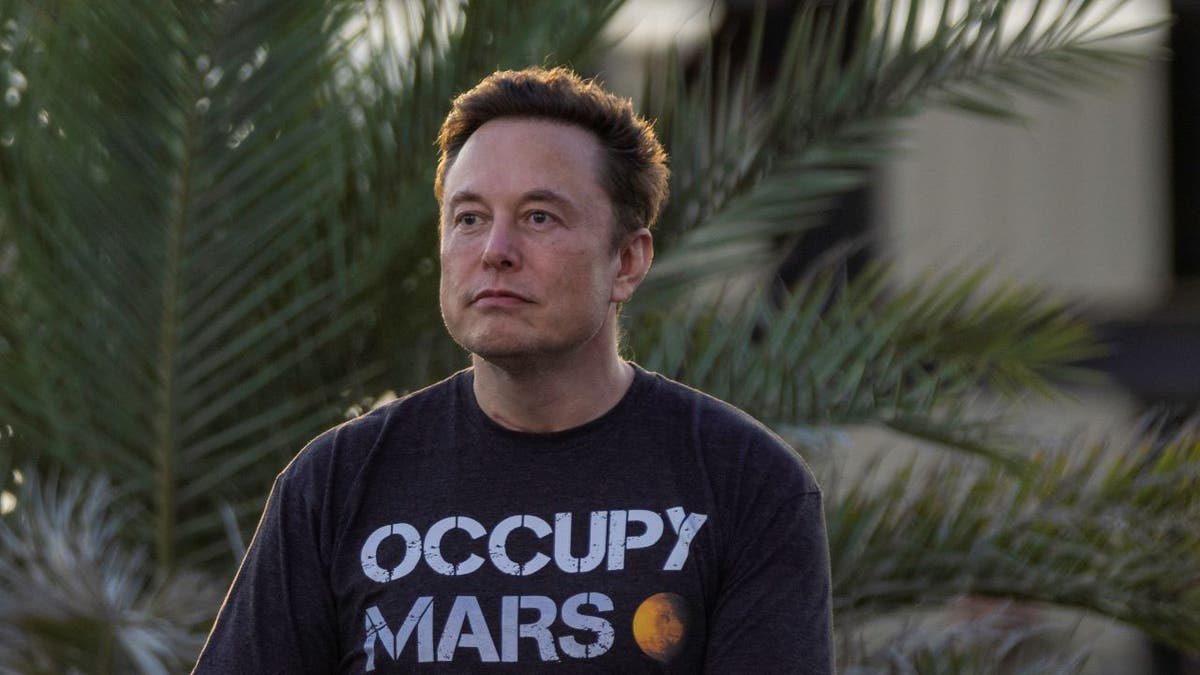 Elon Musk wearing Occupy Mars t-shirt