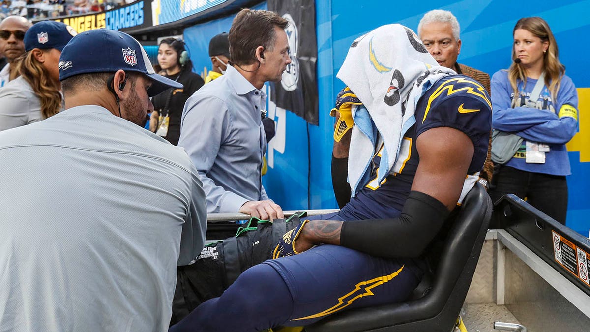 J.C. Jackson is carted off the field after suffering a season-ending knee injury