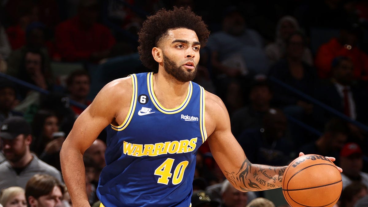 Anthony Lamb dribbles the ball during an NBA game