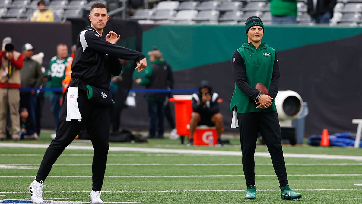 Mike White warms up before a game against the Bears