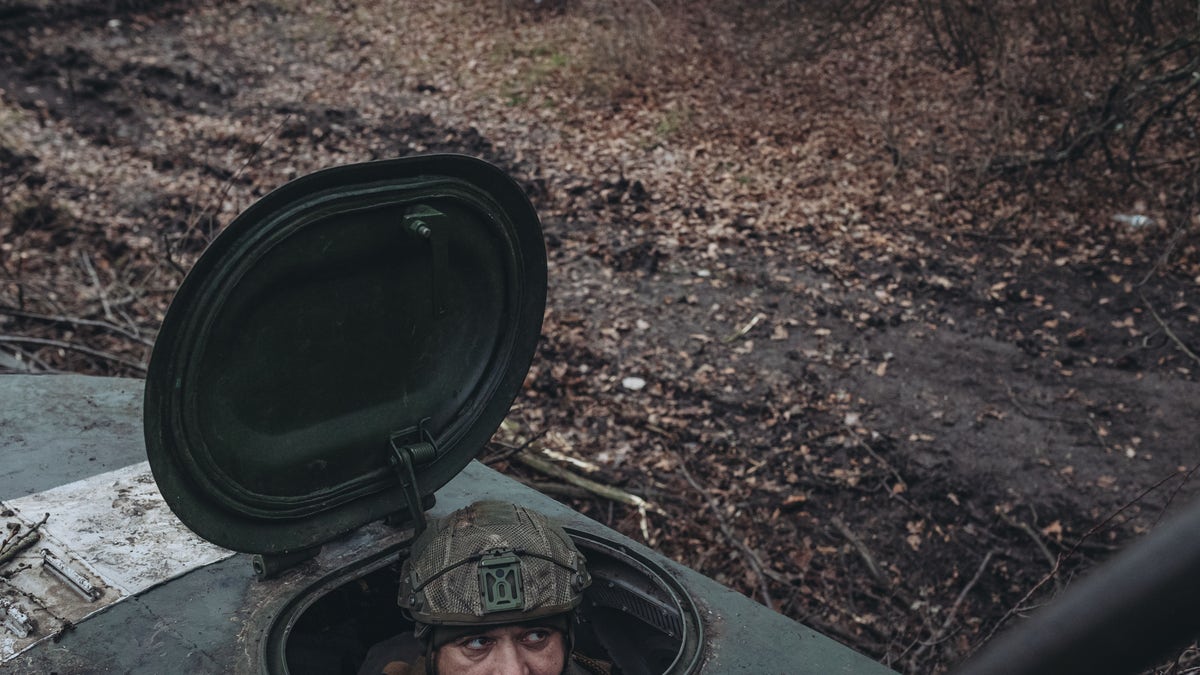 Ukrainian soldier in a tank