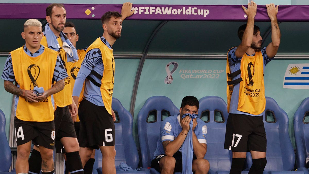 Luis Suarez sits on the bench vs Ghana