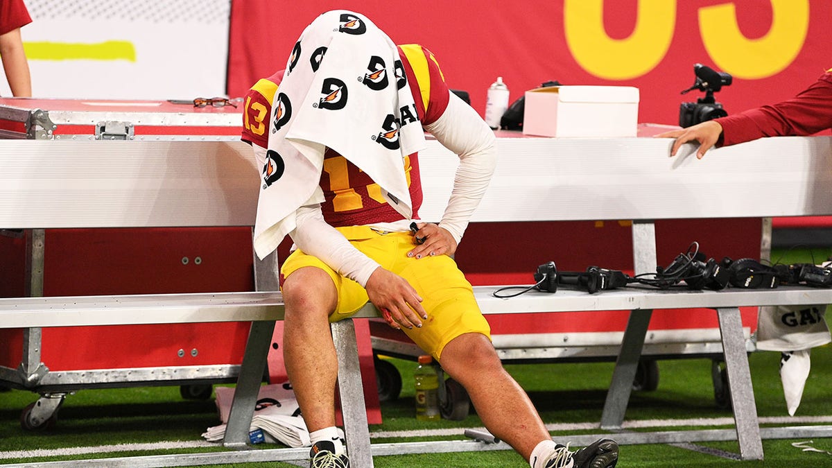 Caleb Williams sits on the bench after losing the Pac-12 championship game