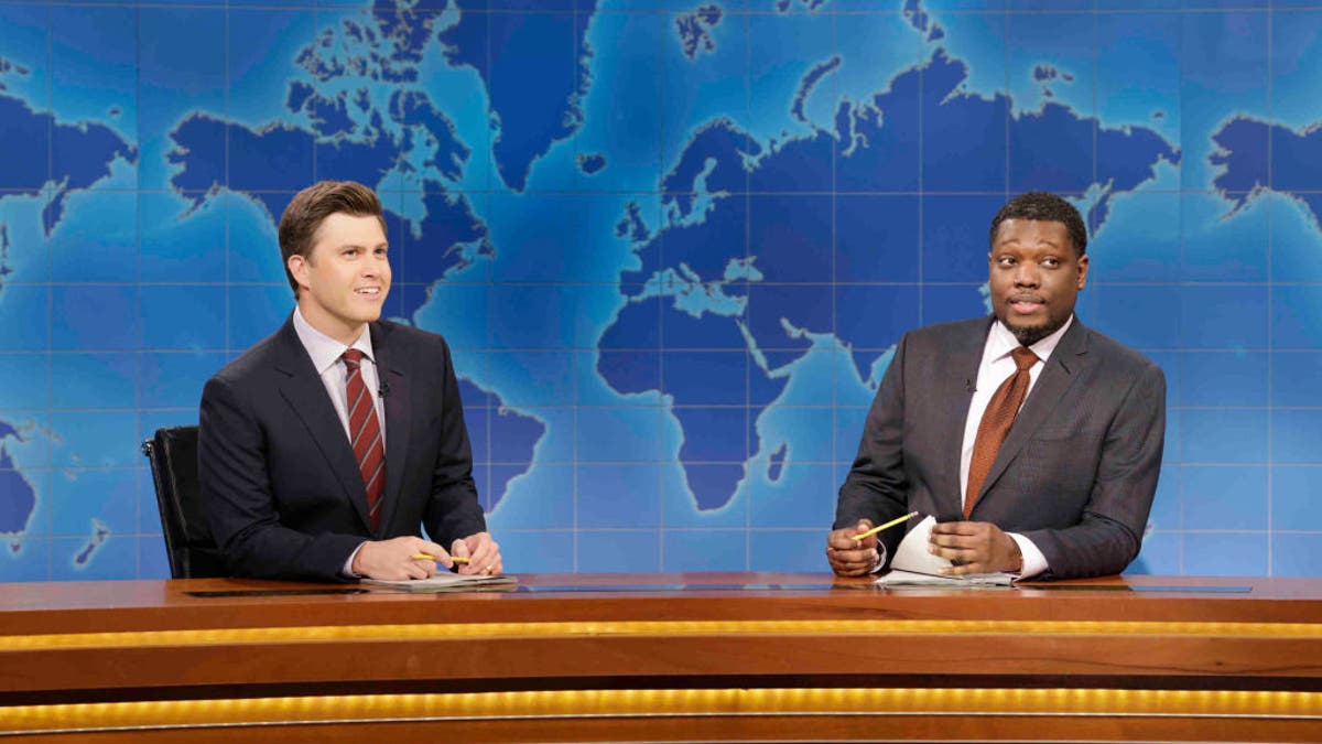 Anchor Colin Jost and anchor Michael Che