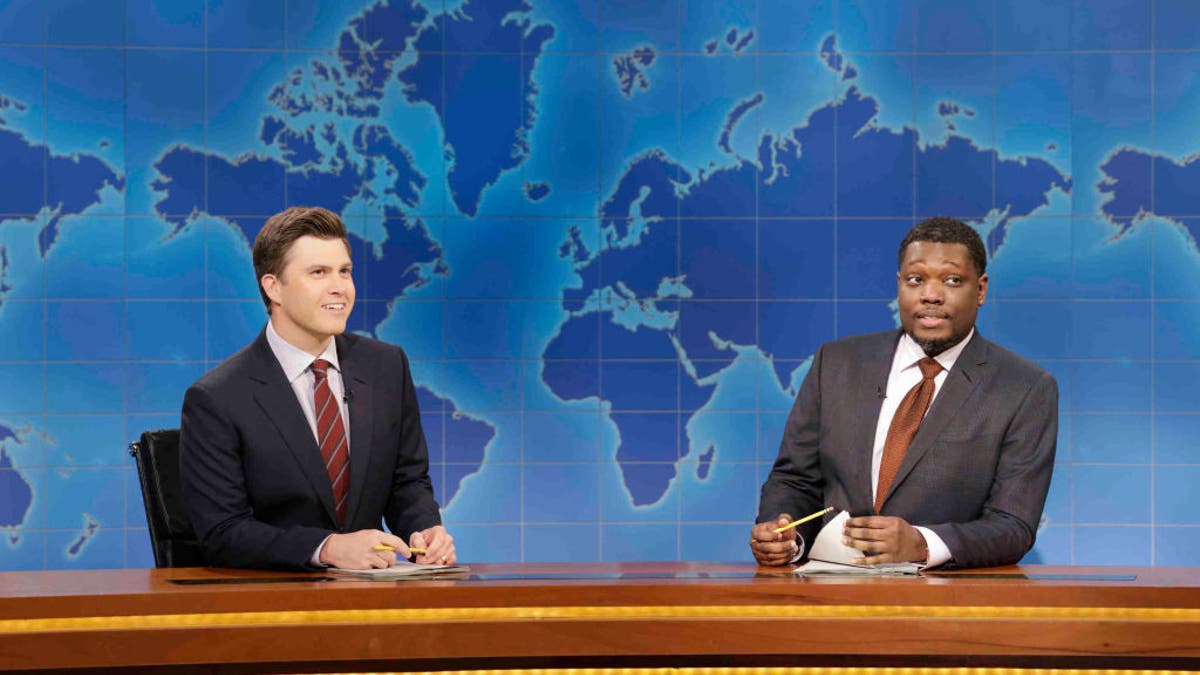 Anchor Colin Jost and anchor Michael Che