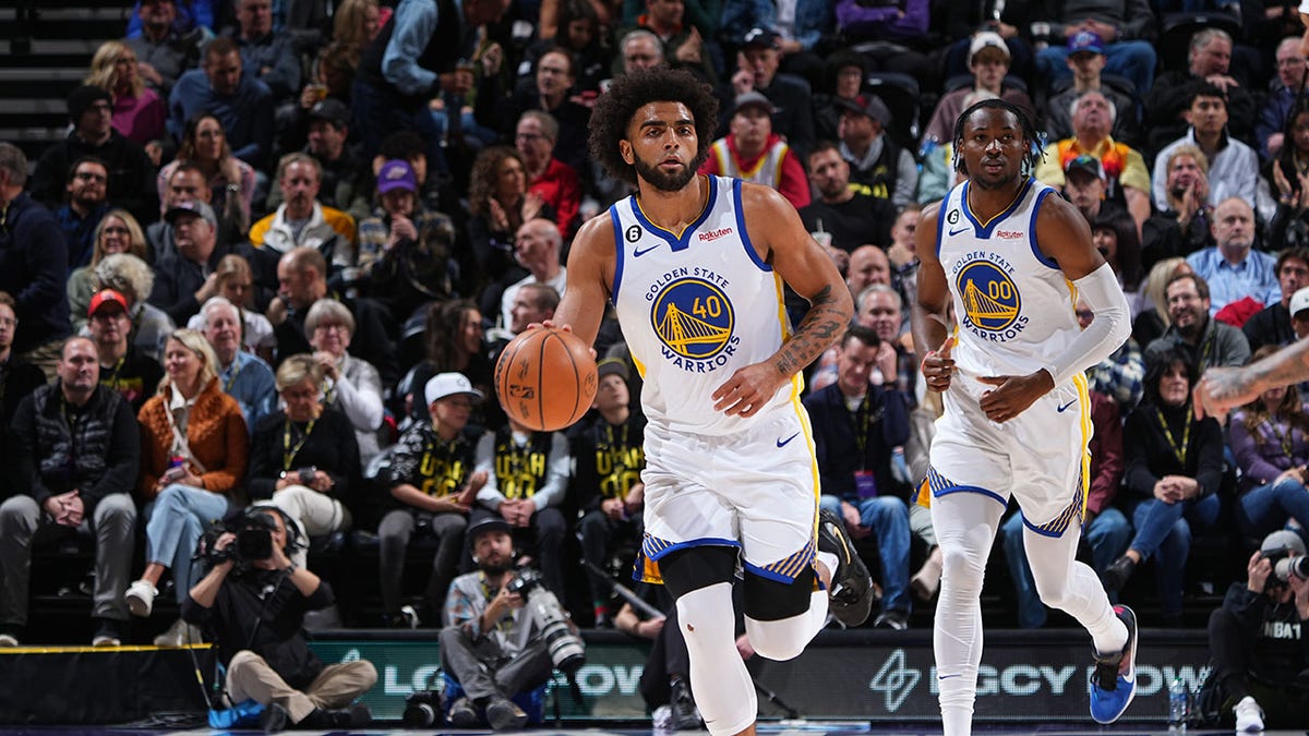 Anthony Lamb dribbles the ball during an NBA game