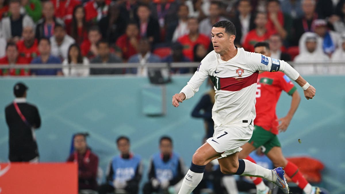 Cristiano Ronaldo dribbles the ball against Morocco