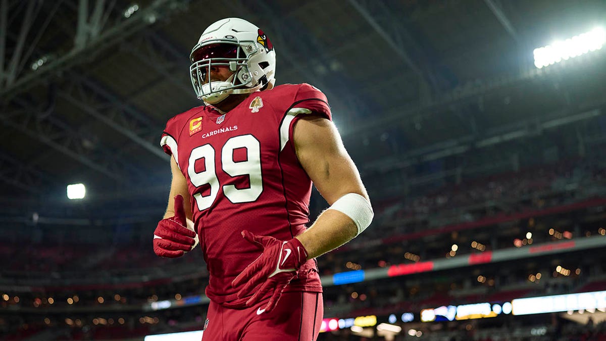 J.J. Watt warms up before a game against the Patriots