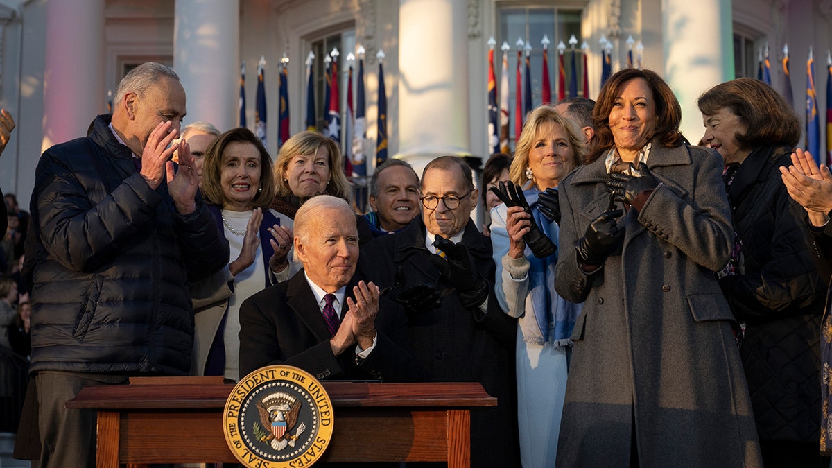 Biden, Harris and others clapping