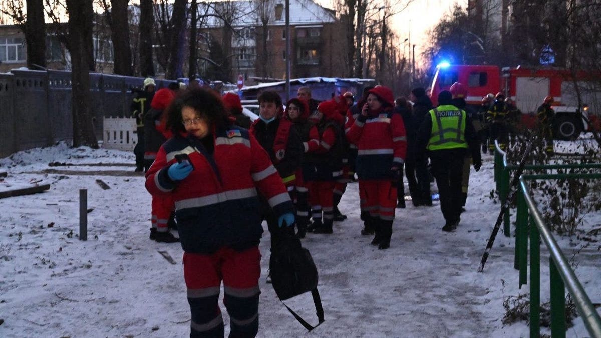 Emergency workers after Kyiv drone strike