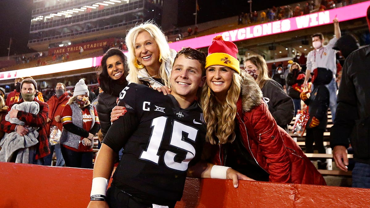 Brock Purdy poses for a picture with his mom and sister