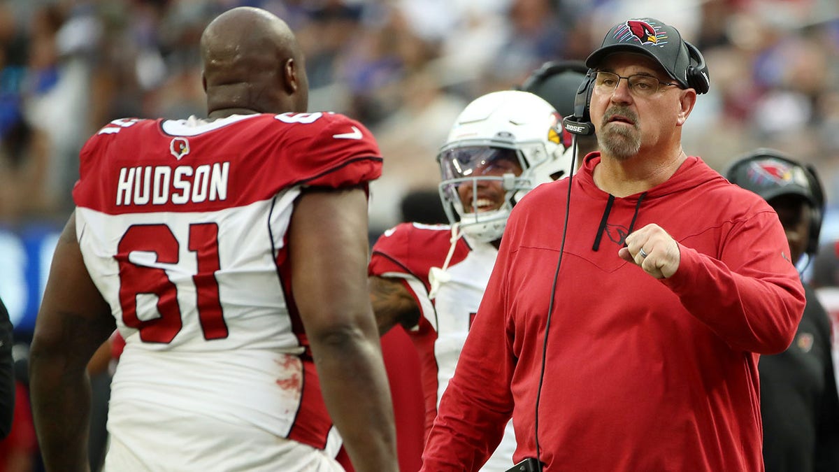 Sean Kugler fist bumps an Arizona player