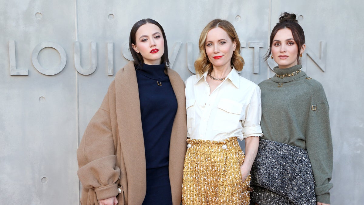 Iris Apatow, Leslie Mann, and Maude Apatow attend the Louis Vuitton's 2023 Cruise Show