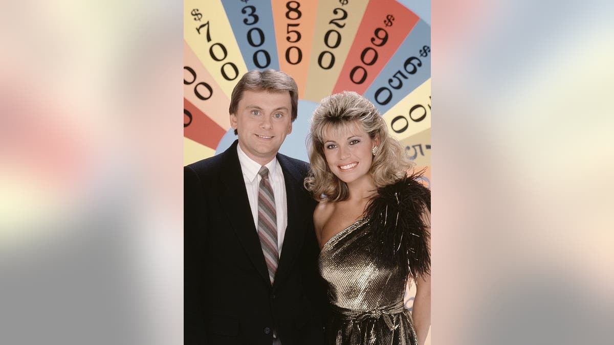 Pat Sajak and Vanna White hosting "Wheel of Fortune" in the 1980s