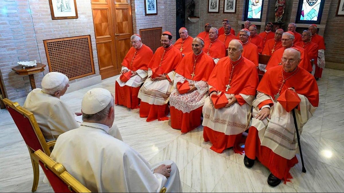 Pope Francis and Pope Emeritus Benedict XVI meet the newly named Cardinals at the Vatican's Mater Ecclesiae Monastery on Aug. 27, 2022, in Vatican City.