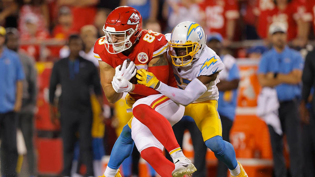 J.C. Jackson tackles a Chiefs player after making a catch